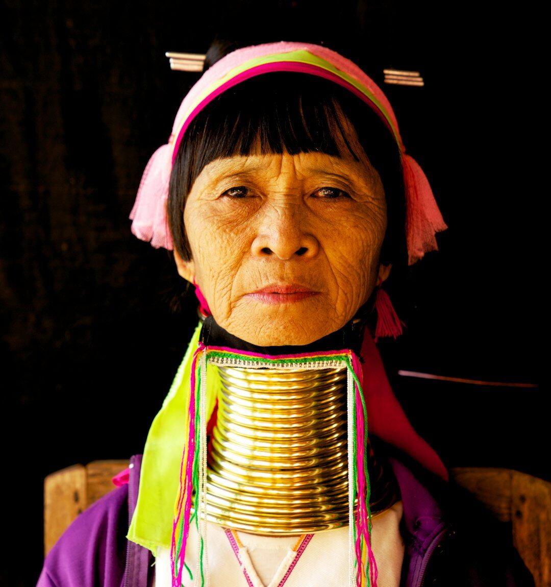 Portrait of a Malay woman smiling in a studio setting